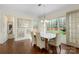 Bright dining room with hardwood floors, large windows, and elegant table set at 518 May Green Dr, Clover, SC 29710