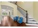 Open foyer with hardwood floors and staircase; showcases the home's bright interior and access to living spaces at 518 May Green Dr, Clover, SC 29710