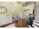 Grand foyer with hardwood floors, staircase, and views of the dining and living areas; bright and spacious at 518 May Green Dr, Clover, SC 29710