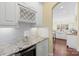 Gourmet kitchen with white cabinets, granite countertops, and stainless steel appliances provides a chef's dream at 518 May Green Dr, Clover, SC 29710