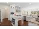 Spacious kitchen with white cabinetry, granite countertops, and stainless steel appliances is an open concept design at 518 May Green Dr, Clover, SC 29710