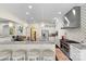 Open kitchen with breakfast bar, stainless steel appliances, and modern pendant lighting at 518 May Green Dr, Clover, SC 29710