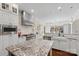 Bright and open kitchen featuring stainless steel appliances, farmhouse sink and granite countertops at 518 May Green Dr, Clover, SC 29710