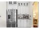 Stainless steel refrigerator with white cabinetry and granite countertops at 518 May Green Dr, Clover, SC 29710