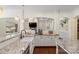 Modern kitchen featuring white cabinetry, granite countertops, and stainless steel appliances at 518 May Green Dr, Clover, SC 29710