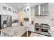 Spacious kitchen featuring stainless steel appliances, white cabinetry and decorative backsplash at 518 May Green Dr, Clover, SC 29710