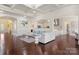 Expansive living room with hardwood floors, modern lighting, and comfortable seating area at 518 May Green Dr, Clover, SC 29710