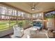 Serene sunroom with panoramic views, comfortable seating, and abundant natural light at 518 May Green Dr, Clover, SC 29710
