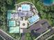 An aerial view of the community's clubhouse, pool, tennis courts, pickleball courts, parking and surrounding landscape at 5301 Mint Harbor Way # 0315, Charlotte, NC 28269