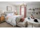 A bright bedroom featuring coordinated decor, soft lighting, and modern furnishings at 5301 Mint Harbor Way # 0315, Charlotte, NC 28269