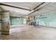 Spacious basement with concrete floor, teal walls, and built-in cabinets at 5643 Twinkle Dr, Concord, NC 28025