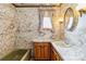 Cozy bathroom with marble walls, patterned curtains, and wooden cabinetry at 5643 Twinkle Dr, Concord, NC 28025
