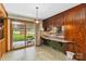 Dining area with sliding glass doors to patio; features built in desk and cabinets at 5643 Twinkle Dr, Concord, NC 28025