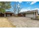Brick home with a spacious driveway, attached garages, and well-kept landscaping at 5643 Twinkle Dr, Concord, NC 28025