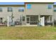 A spacious backyard with a patio, screened in porch, and a well-maintained lawn at 6021 Sweetbay Ln, Indian Land, SC 29707