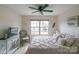 Well-lit bedroom featuring a comfortable bed, side table, and soft natural light from the window at 6021 Sweetbay Ln, Indian Land, SC 29707