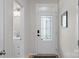 Elegant front door with decorative glass and modern hardware, leading into a bright home at 6021 Sweetbay Ln, Indian Land, SC 29707