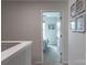 Upstairs hallway leading to bedrooms with neutral paint and carpet at 6021 Sweetbay Ln, Indian Land, SC 29707