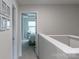 Upstairs hallway leading to bedrooms with neutral paint and carpet at 6021 Sweetbay Ln, Indian Land, SC 29707