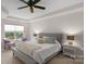 Main bedroom with natural light, a tray ceiling, and plush decor at 6021 Sweetbay Ln, Indian Land, SC 29707
