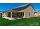 Backyard with green grass and covered patio for outdoor enjoyment at 6026 Gray Shadow Ct, York, SC 29745
