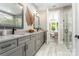 The primary bath showcases double sink vanity with stone countertop and decorative leaf accent at 6026 Gray Shadow Ct, York, SC 29745