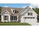 Charming single Gathering home with a two-car garage and beautiful landscaping at 6026 Gray Shadow Ct, York, SC 29745