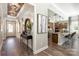 Hallway with view into the kitchen, wood floors, and decorative elements at 6026 Gray Shadow Ct, York, SC 29745