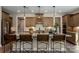 Kitchen island boasts granite countertops and stylish seating with pendant lighting at 6026 Gray Shadow Ct, York, SC 29745