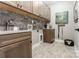 Well-equipped laundry room features counter space and storage cabinets at 6026 Gray Shadow Ct, York, SC 29745