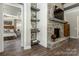 The living room is anchored by a stone fireplace and features open shelving at 6026 Gray Shadow Ct, York, SC 29745
