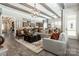 The open living room with wood beam ceiling flows seamlessly to the kitchen and dining area at 6026 Gray Shadow Ct, York, SC 29745