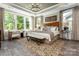 Inviting main bedroom with decorative rug and many windows that allow ample natural light at 6026 Gray Shadow Ct, York, SC 29745