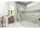 This primary ensuite bathroom features a glass enclosed tile shower with decorative mosaic tile at 6026 Gray Shadow Ct, York, SC 29745