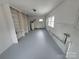 Spacious, unfinished basement with plenty of room for storage and multiple built-in shelving units at 603 E Main St, Rock Hill, SC 29730