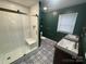 Stylish bathroom with tiled shower, double sinks, and modern fixtures at 603 E Main St, Rock Hill, SC 29730