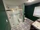 Bathroom showcasing a beautifully tiled shower with glass doors and modern fixtures at 603 E Main St, Rock Hill, SC 29730