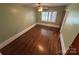 Bright bedroom with hardwood floors and a window offering natural light at 603 E Main St, Rock Hill, SC 29730