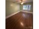 Bright bedroom with hardwood floors and a ceiling fan at 603 E Main St, Rock Hill, SC 29730