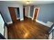 Bedroom showcasing hardwood floors, closets, and natural light, ready for personalization at 603 E Main St, Rock Hill, SC 29730