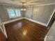 Bright dining room featuring hardwood floors and a modern light fixture at 603 E Main St, Rock Hill, SC 29730