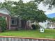 Charming brick home with mature trees and a well-maintained lawn and 'For Sale' sign at 603 E Main St, Rock Hill, SC 29730