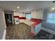 Spacious kitchen with white appliances, red countertops, and vintage charm at 603 E Main St, Rock Hill, SC 29730