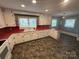 Classic kitchen featuring white cabinets, red countertops, and abundant natural light at 603 E Main St, Rock Hill, SC 29730