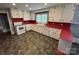 Spacious kitchen with vintage-style cabinets, unique countertops, and neutral flooring at 603 E Main St, Rock Hill, SC 29730
