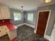 Quaint kitchen nook with retro red countertops, neutral walls, and natural light at 603 E Main St, Rock Hill, SC 29730