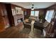 Staged living room with wood paneling, fireplace, and comfortable seating area at 603 E Main St, Rock Hill, SC 29730