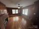 Comfortable living room with wood paneling and a cozy fireplace at 603 E Main St, Rock Hill, SC 29730