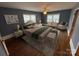 Staged main bedroom with hardwood floors, neutral tones, and ample natural light at 603 E Main St, Rock Hill, SC 29730