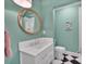 Charming bathroom with updated vanity, modern fixtures, and black & white checkered floors at 8150 Malibu Pointe Ln, Denver, NC 28037